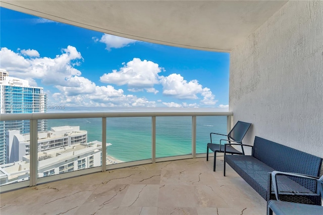 balcony featuring a water view