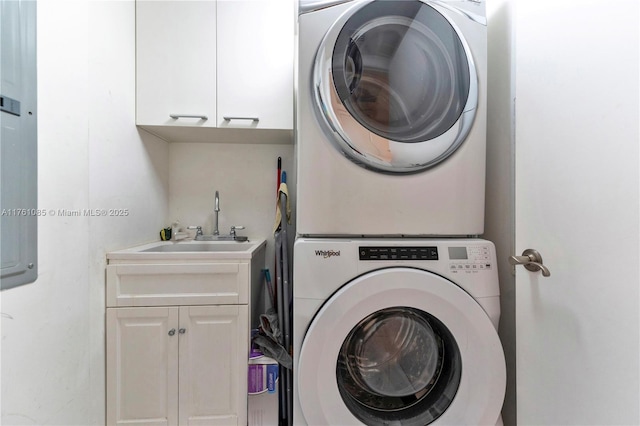 17201 Collins Ave Unit 3708, Sunny Isles Beach, FL 33160 - laundry room with stacked washing machine and dryer and cabinet space