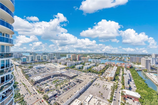 birds eye view of property featuring a view of city and a water view