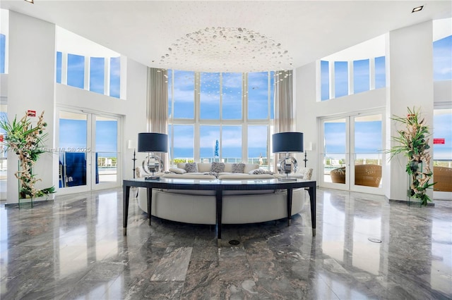 17201 Collins Ave Unit 3708, Sunny Isles Beach, FL 33160 - living area featuring a towering ceiling, french doors, and marble tiled flooring