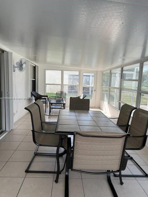 sunroom / solarium featuring a healthy amount of sunlight