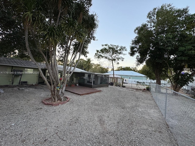 view of front of house with a deck and a fenced backyard