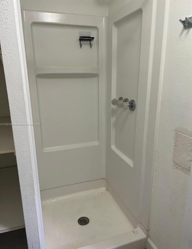 bathroom featuring a stall shower