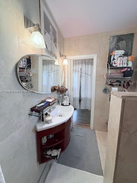 1643 Nethia Dr, Miami, FL 33133 - bathroom with tile patterned floors and vanity