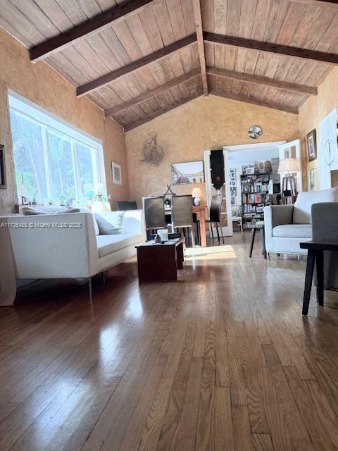 1643 Nethia Dr, Miami, FL 33133 - living area with dark wood-style floors, high vaulted ceiling, wooden ceiling, and beam ceiling