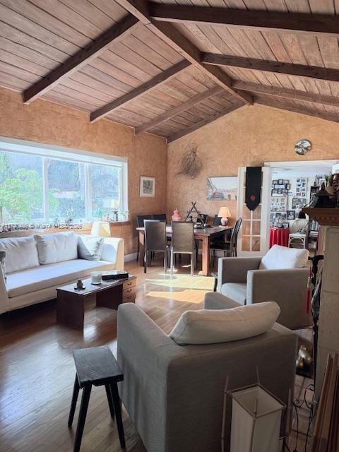 living room with lofted ceiling with beams, wood finished floors, and wood ceiling