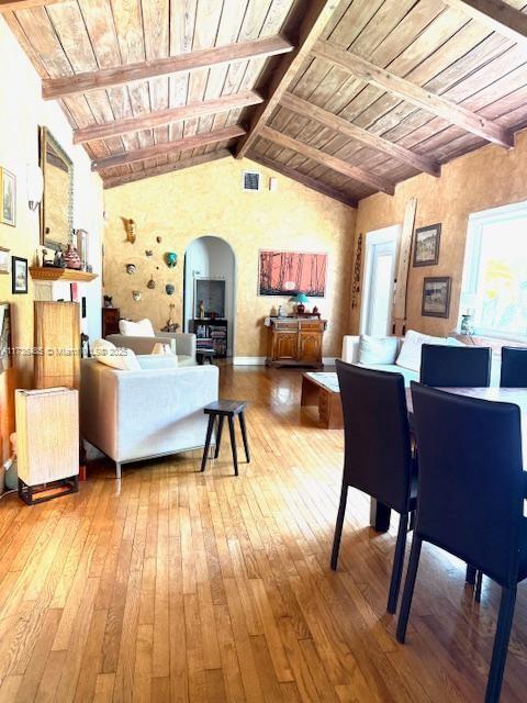 1643 Nethia Dr, Miami, FL 33133 - living area featuring arched walkways, wooden ceiling, and hardwood / wood-style floors