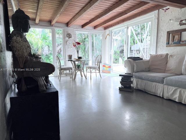 1643 Nethia Dr, Miami, FL 33133 - sunroom with finished concrete floors and beam ceiling