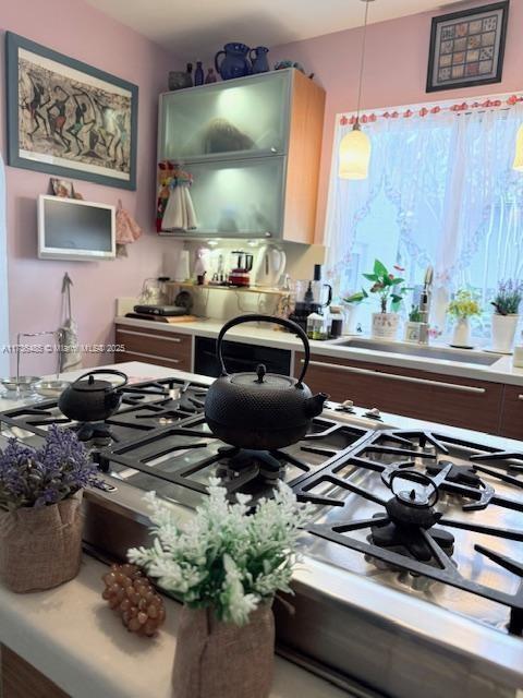 1643 Nethia Dr, Miami, FL 33133 - kitchen with light countertops and pendant lighting