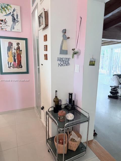 1643 Nethia Dr, Miami, FL 33133 - hall with baseboards and tile patterned flooring