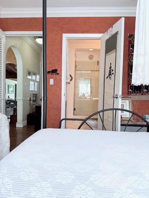 1643 Nethia Dr, Miami, FL 33133 - bedroom with arched walkways, crown molding, and wood finished floors