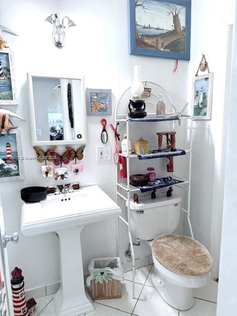 1643 Nethia Dr, Miami, FL 33133 - bathroom featuring toilet and tile patterned floors