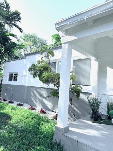 view of side of property featuring stucco siding