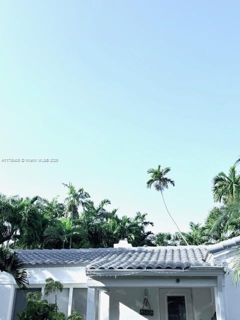 1643 Nethia Dr, Miami, FL 33133 - exterior details with stucco siding and a tile roof
