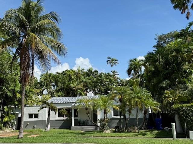 1643 Nethia Dr, Miami, FL 33133 - view of front of home featuring a front yard and stucco siding