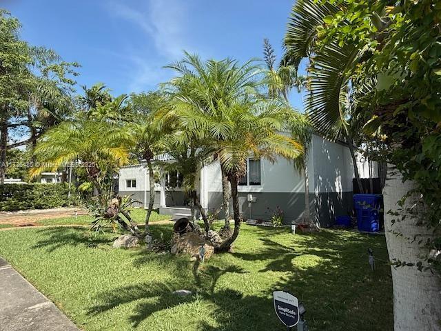 1643 Nethia Dr, Miami, FL 33133 - view of side of home with a lawn