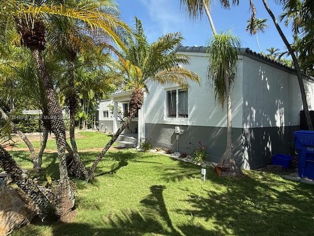 1643 Nethia Dr, Miami, FL 33133 - view of property exterior featuring a lawn