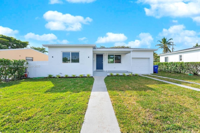 single story home with a front yard, fence, driveway, an attached garage, and stucco siding