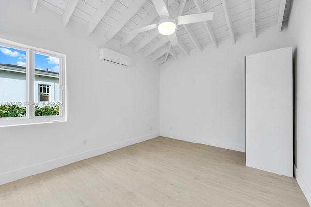 unfurnished room with baseboards, ceiling fan, lofted ceiling with beams, a wall unit AC, and light wood-style flooring