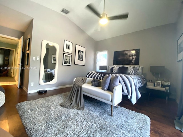 bedroom with wood finished floors, baseboards, visible vents, ceiling fan, and vaulted ceiling