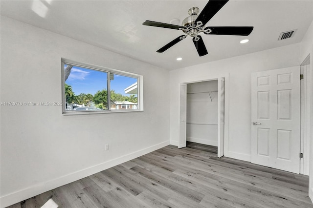 unfurnished bedroom featuring visible vents, baseboards, and light wood finished floors