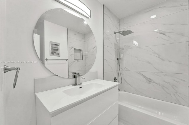 bathroom featuring shower / washtub combination and vanity