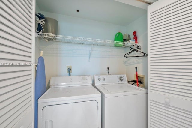 laundry room featuring washer and clothes dryer and laundry area