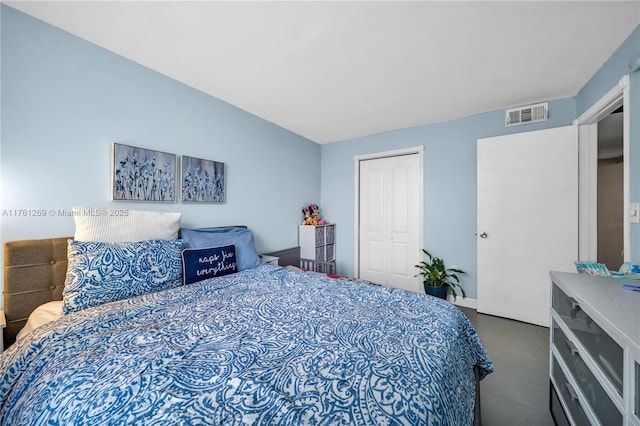 bedroom with a closet and visible vents