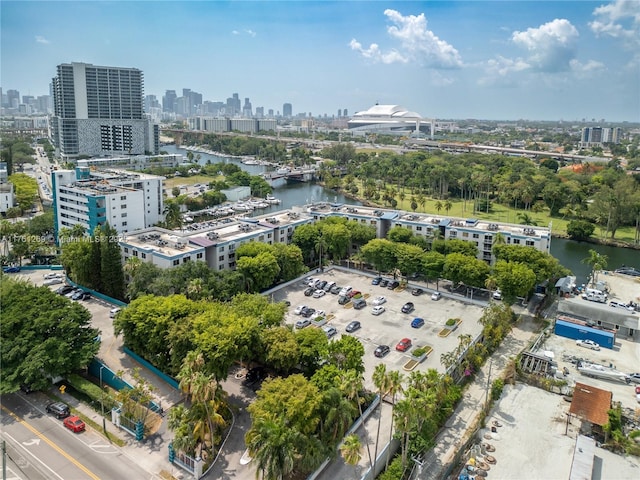 birds eye view of property with a view of city and a water view