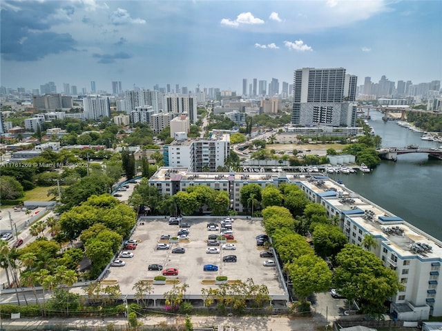 birds eye view of property featuring a view of city and a water view