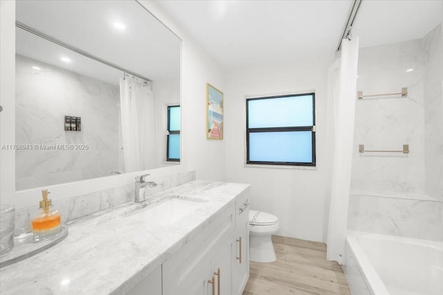 full bathroom featuring a washtub, toilet, a shower with shower curtain, and wood finished floors