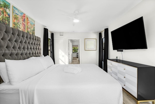 bedroom with a ceiling fan and light wood finished floors