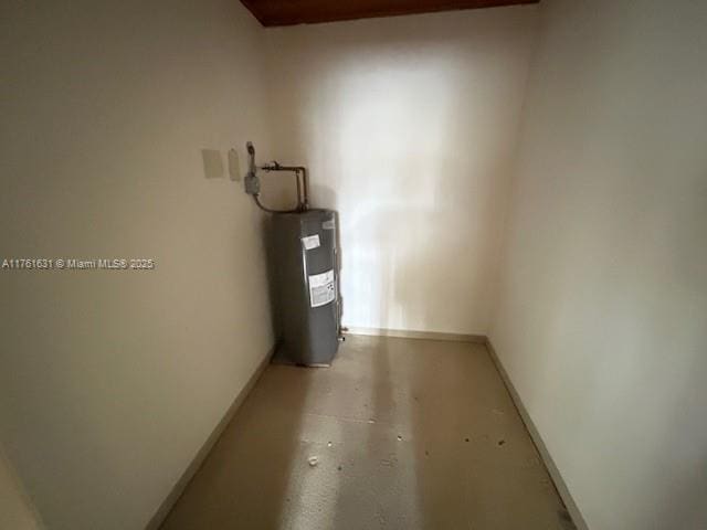 utility room with electric water heater