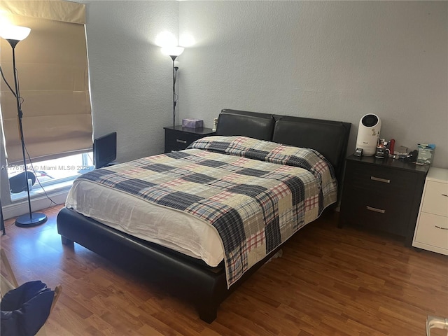 bedroom with wood finished floors