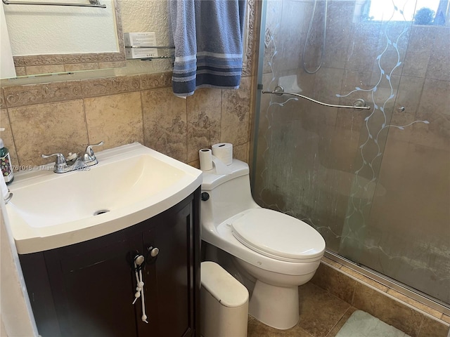 full bathroom with vanity, a shower stall, and toilet