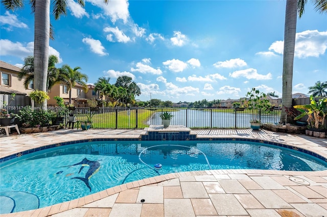 view of pool featuring a patio area, fence, a fenced in pool, and a water view