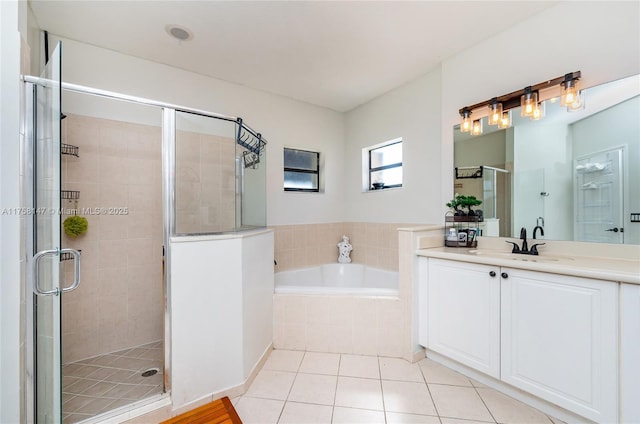 bathroom with vanity, a stall shower, tile patterned flooring, and a bath