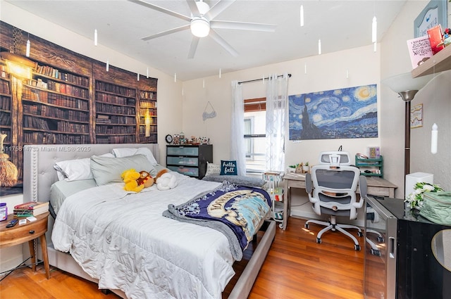 bedroom with wood finished floors