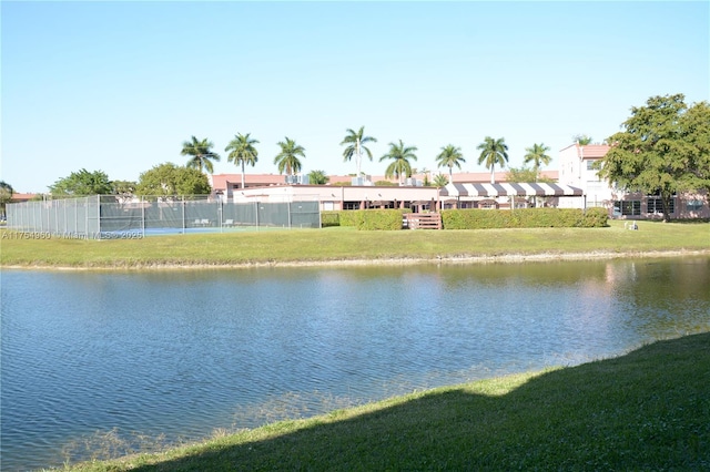 property view of water featuring fence