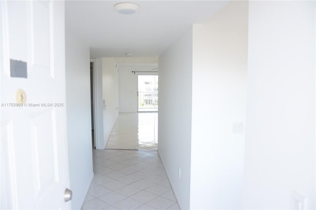 hallway featuring light tile patterned floors