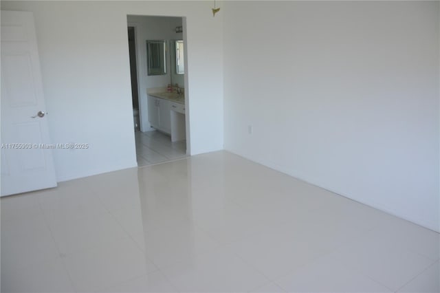 empty room with light tile patterned floors