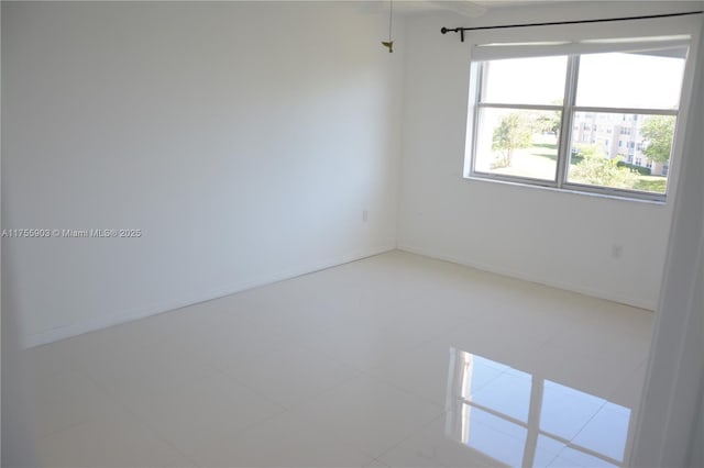 empty room with baseboards