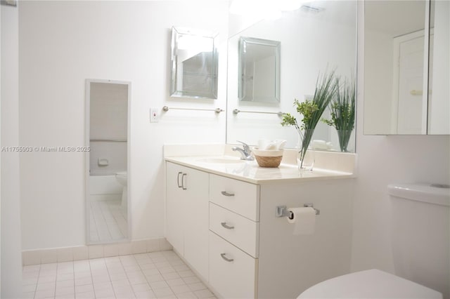 full bath with vanity, toilet, and tile patterned flooring