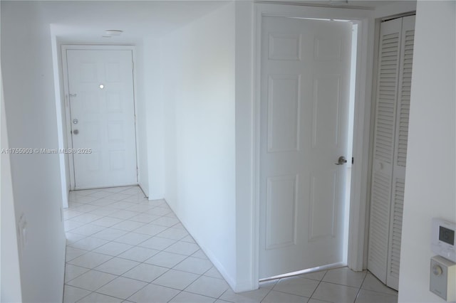 hallway featuring light tile patterned flooring