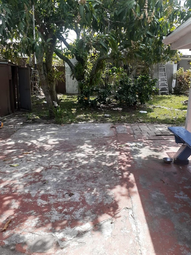 view of yard featuring a patio area and fence