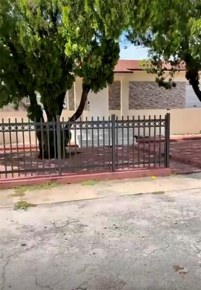 view of gate with fence