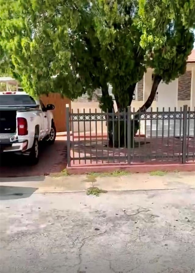 view of gate with fence