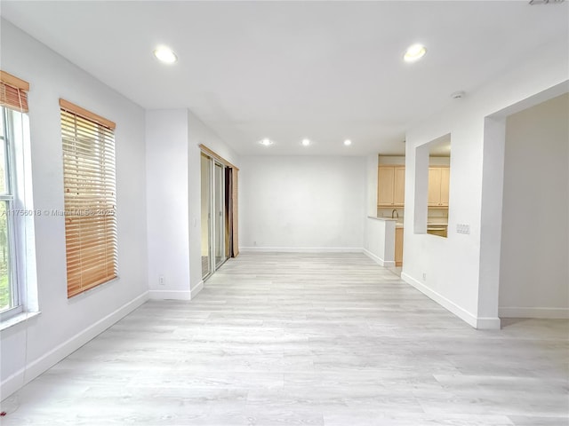 5737 NW 119th Dr Unit 5737, Coral Springs, FL 33076 - spare room with recessed lighting, baseboards, and light wood finished floors
