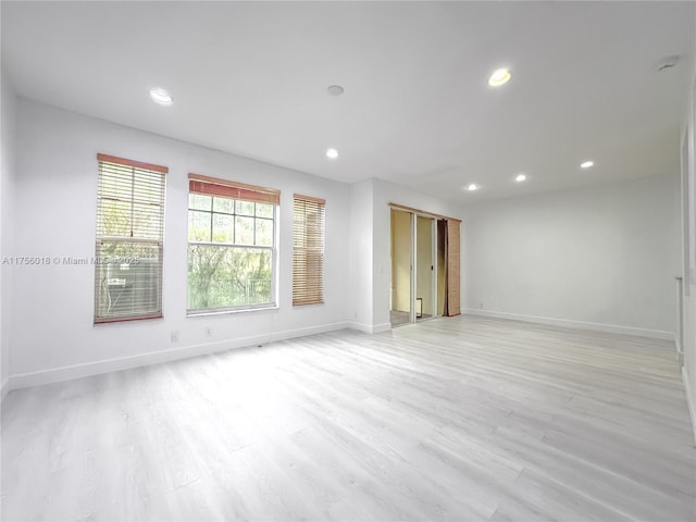 5737 NW 119th Dr Unit 5737, Coral Springs, FL 33076 - empty room featuring recessed lighting, baseboards, and light wood finished floors
