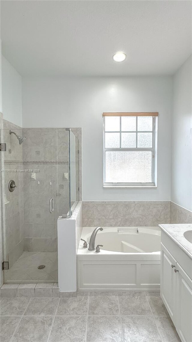 5737 NW 119th Dr Unit 5737, Coral Springs, FL 33076 - bathroom featuring a stall shower, a bath, vanity, and tile patterned flooring